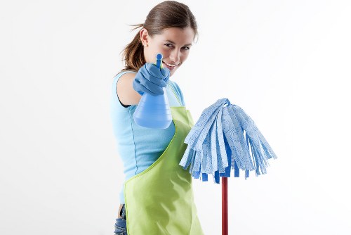 After builders cleaning team removing renovation dust in a Lambeth home