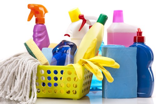 Cleaner vacuuming a living room in a Lambeth apartment